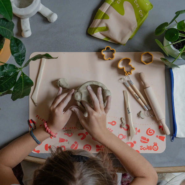 Pottery sculpting with Sculpd kids mess mat